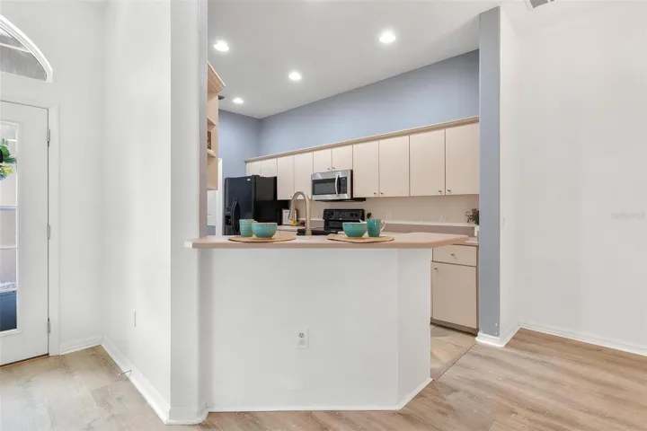Kitchen over looks dining and living area.
