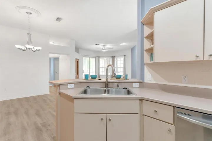 Kitchen over looks dining and living area.