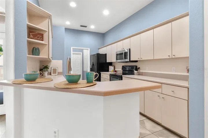 Kitchen over looks dining and living area.