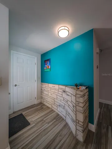 Architectural wall greets you with stone accents mid centruy !