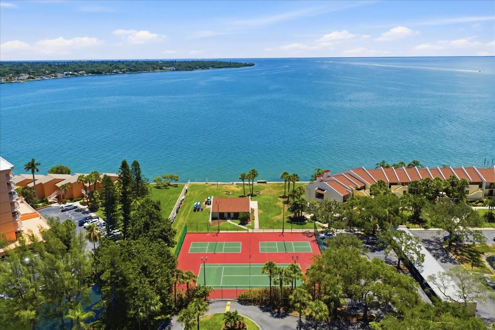 Pickle ball, tennis, club house, and kayak storage