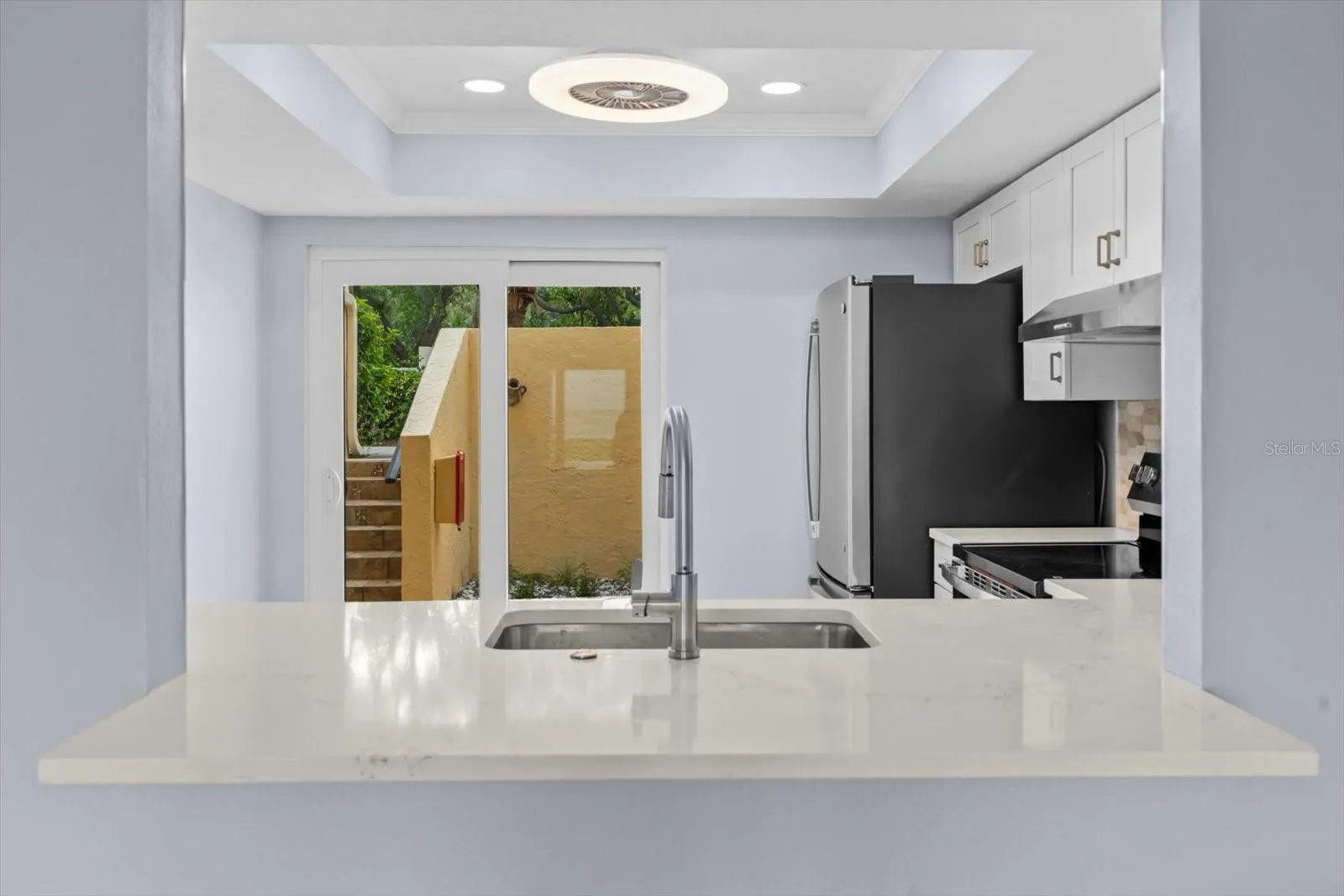Sliders off the kitchen to your private front patio