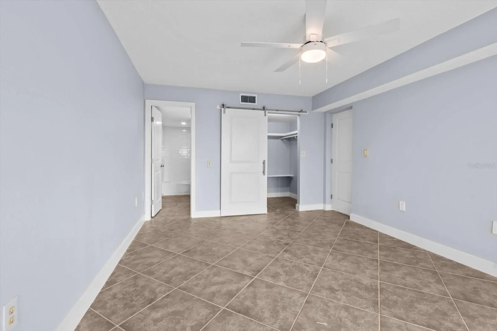 View of the En-suite bathroom and walk in closet, primary bedroom