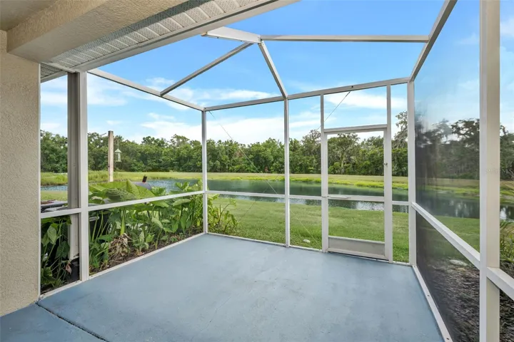 Private screened-in lanai with water and conservation views