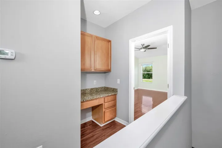 Desk feature leading into primary bedroom