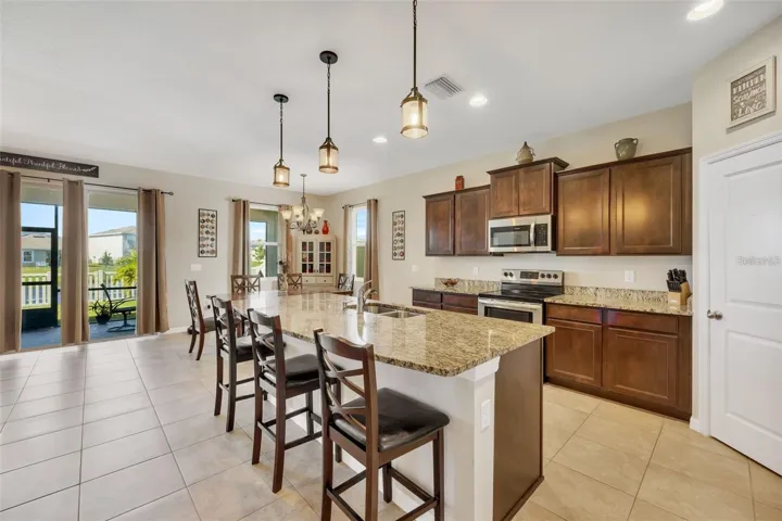 Open Concept Kitchen with Granite Countertops, Large Island &amp; Pantry