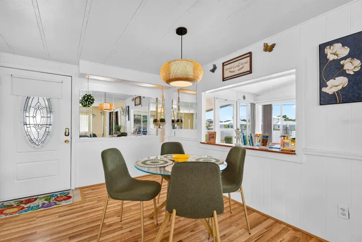 Entry into home showing dining area off to the side and open front lanai