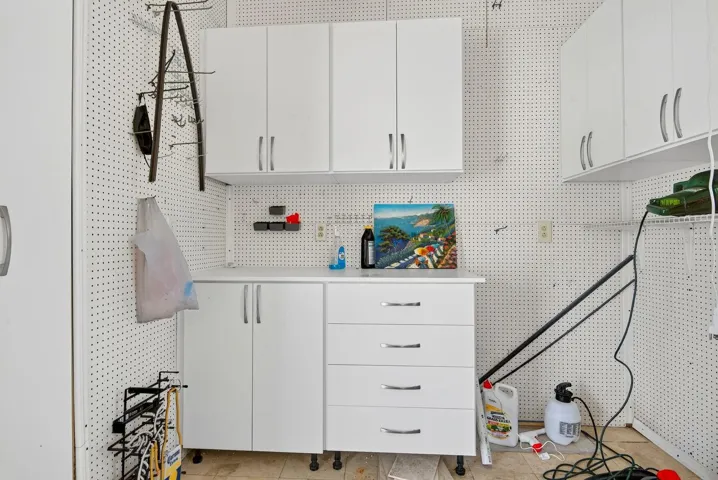 Extra storage and plenty of cabinets to stay organized  in the attached area