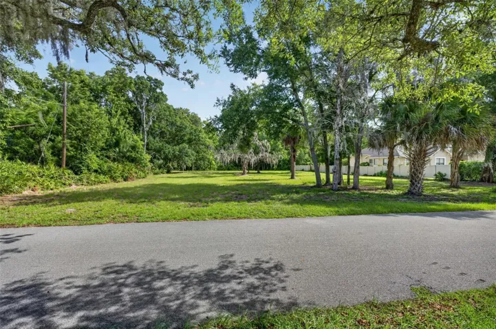 Attractive street frontage welcomes you to this private 1-acre homesite in the heart of Lake Mary.