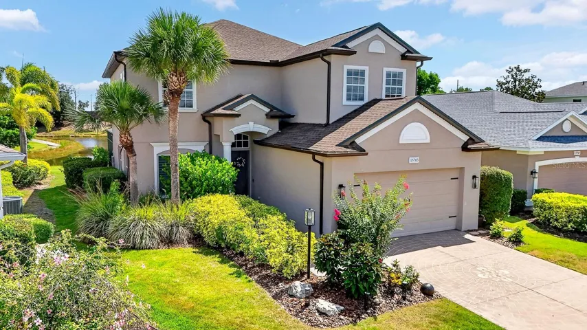 Gorgeous view of landscaping and custom home