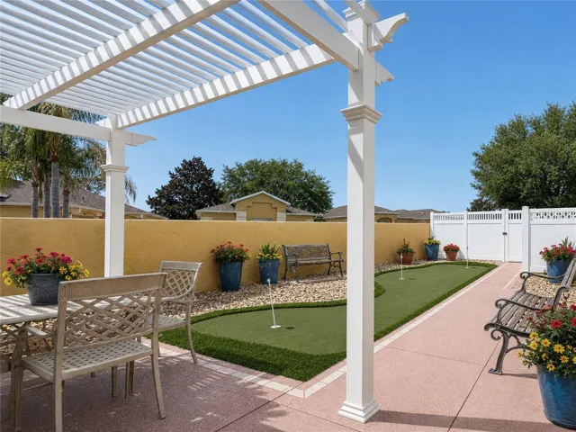 ENORMOUS AMOUNT OF OUTDOOR LIVING SPACE - INCLUDES A 3 HOLE PUTTING GREEN!