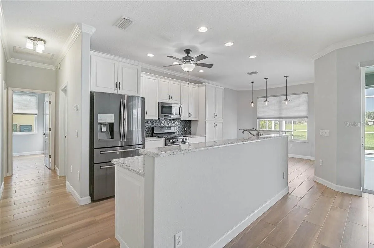 Just to the right of the kitchen are the 2 guest bedrooms, laundry, and 2nd bath