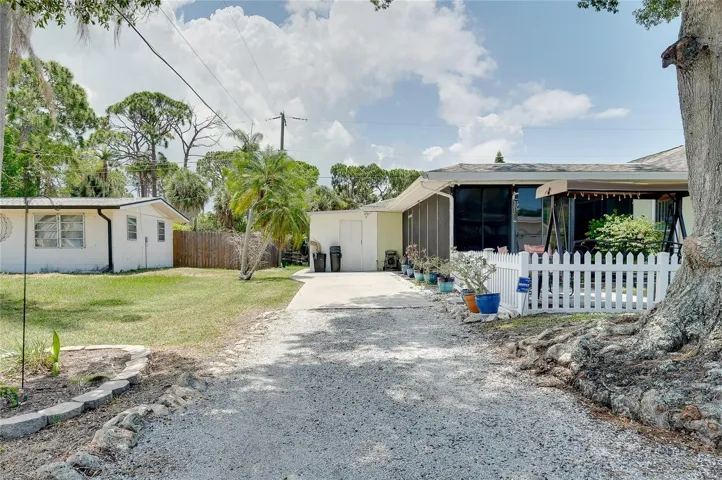 Side entry driveway with shed