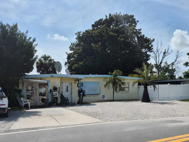 Front of store and of house facing Flamingo Drive.