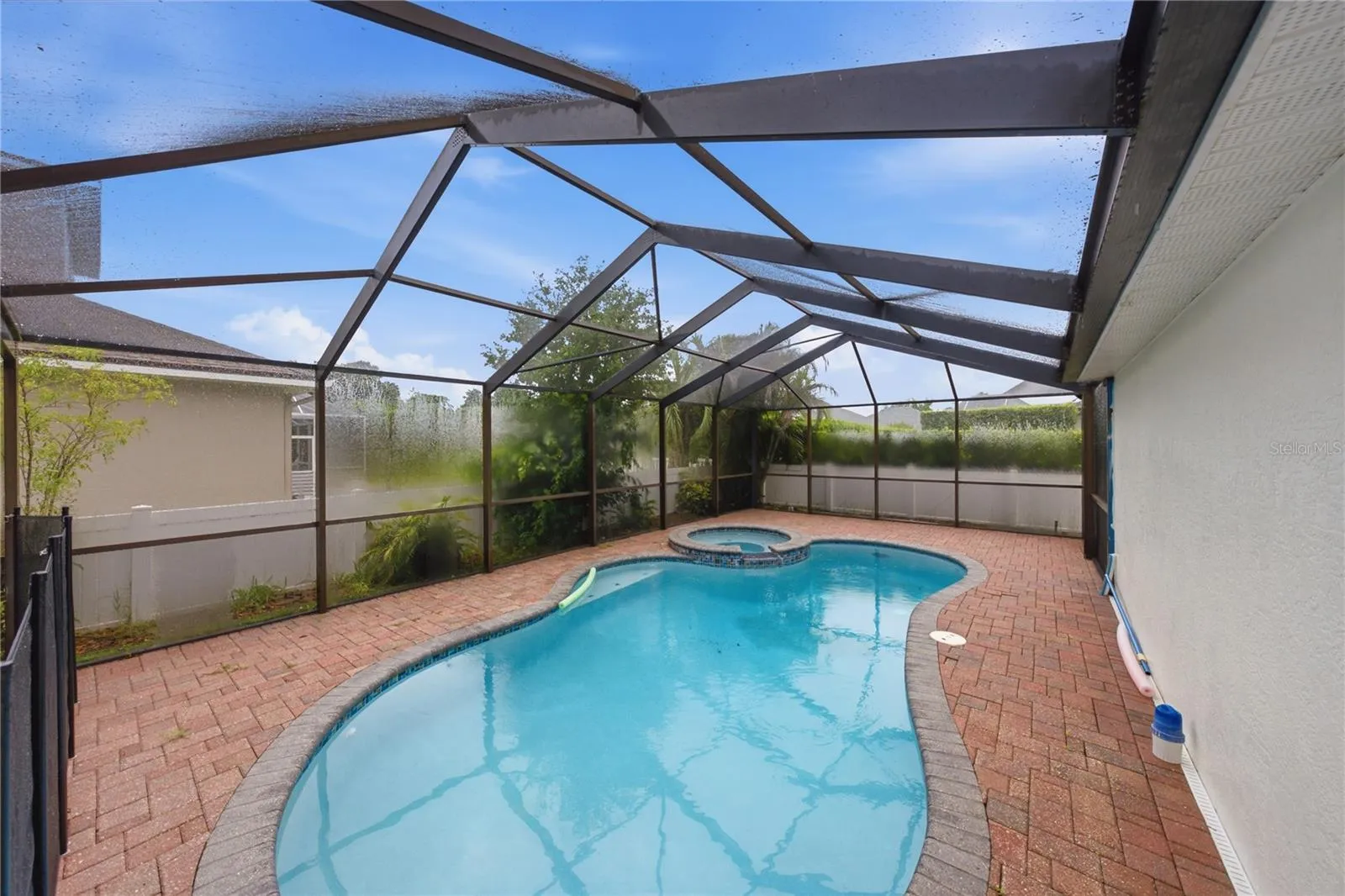 Screened and pavered freeform pool
