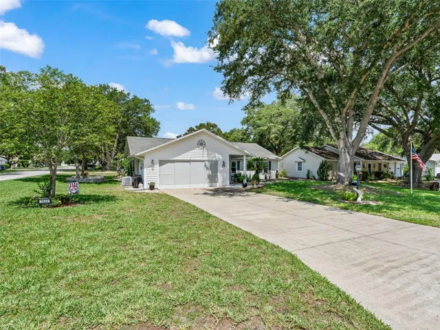 FRONT VIEW WITH LONG DRIVEWAY