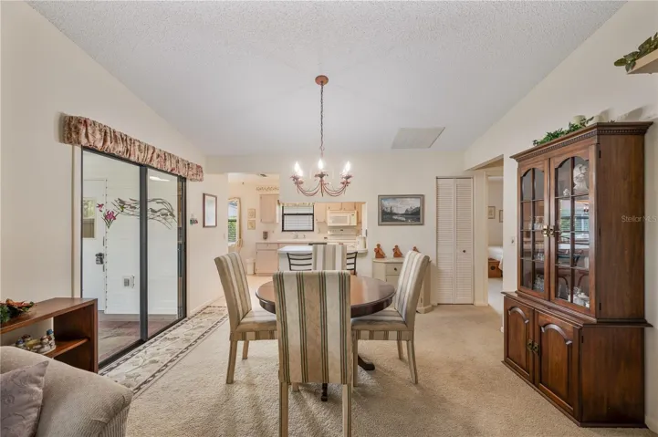 Dining room with sliding doors to the screened porch