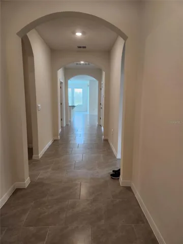 Standing at the front door