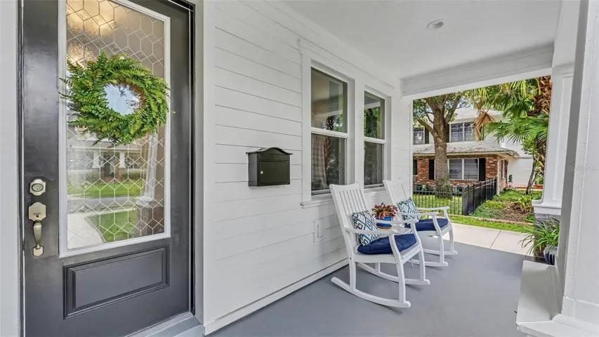 Gorgeous covered front porch, perfect for listening to the rain