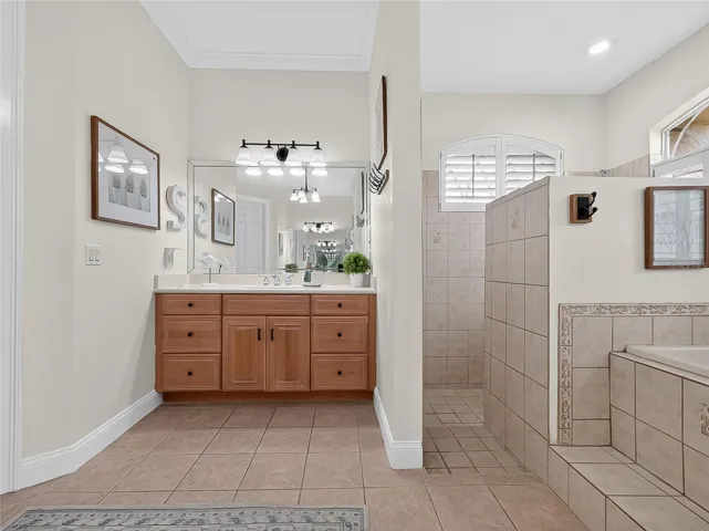 Primary bathroom with walk in shower, dual vanities, soaker tub and walk in shower