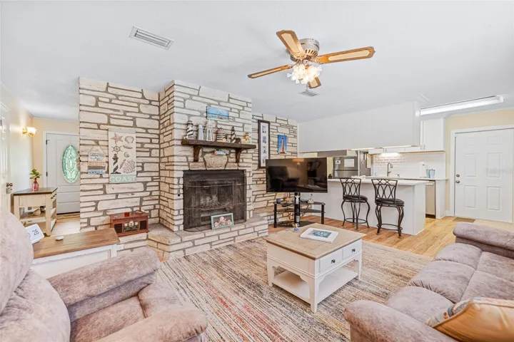 Family Room w Wood Burning Fireplace