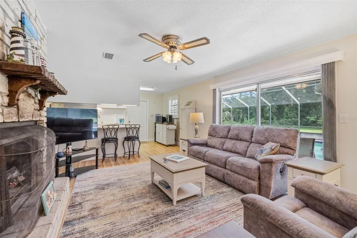 Family Room w Wood Burning Fireplace