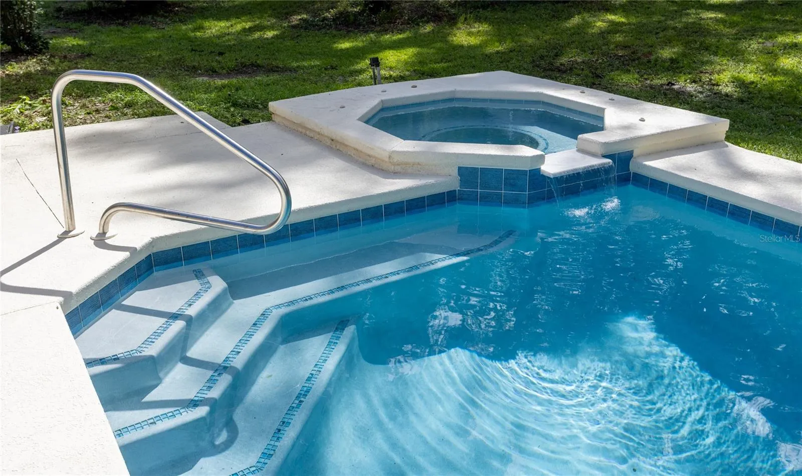 New Heated Spa with Waterfall Feature
