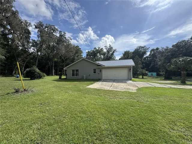 Side of Property with Garage View