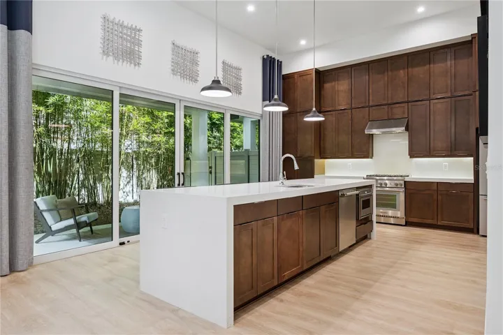 Gourmet Kitchen with Stacked Upper Flat Cabinets
