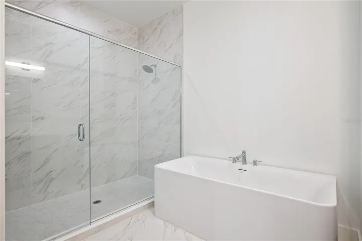 Primary Bath with Dual Sinks/Soak-in Tub and Large Walk-In Shower