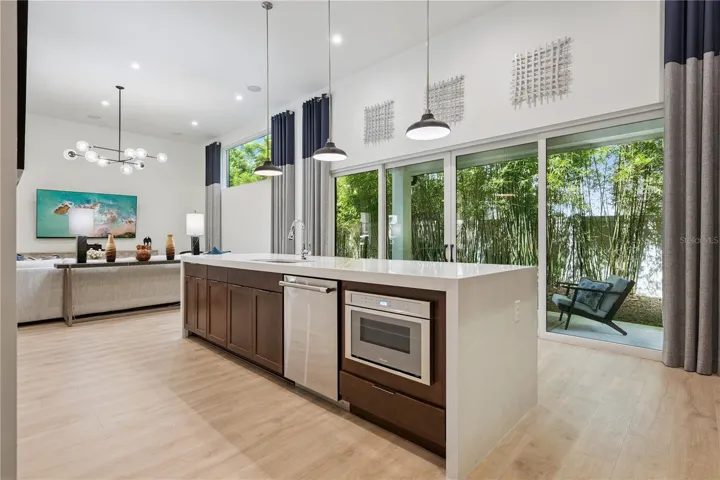 Quartz Waterfall Island with oversized sink and built-in microwave
