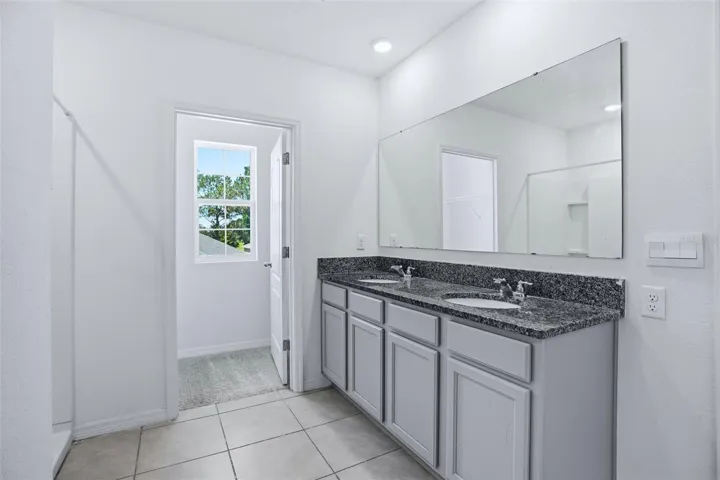 Primary Bathroom and second walk in closet