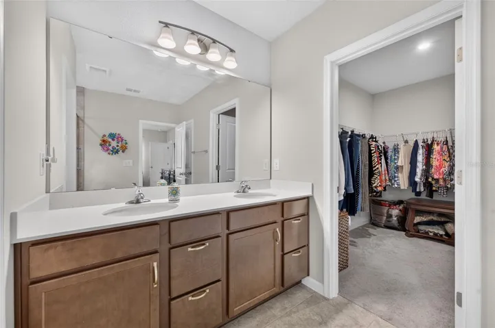 Primary bathroom with spacious walk-in closet