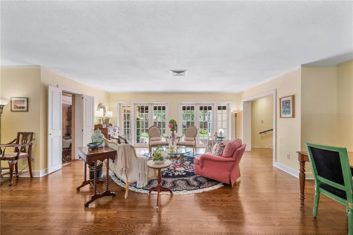 Formal living room with French doors and hardwood floors