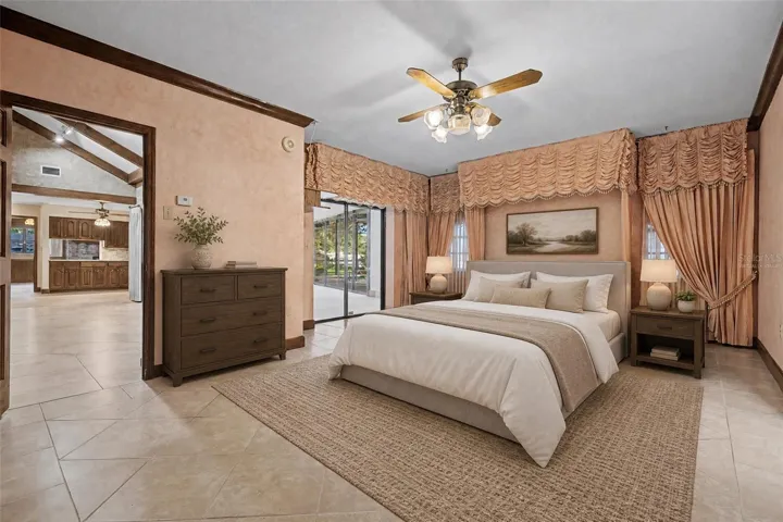Virtually Staged. Master suite with slider to Enclosed patio