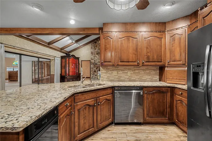 Kitchen features Breakfast bar seating and granite countertops