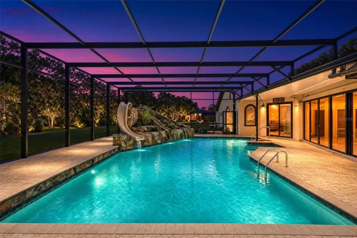 Sparkling Pool with slide, waterfall and screen.