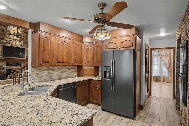 Kitchen features Breakfast bar seating and granite countertops