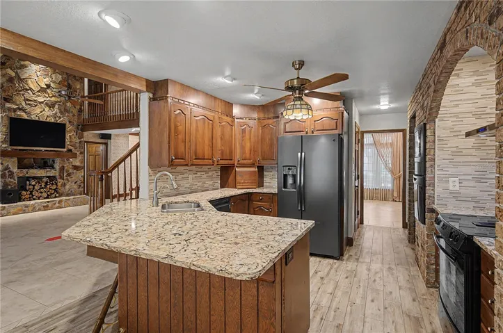 Kitchen features Breakfast bar seating and granite countertops