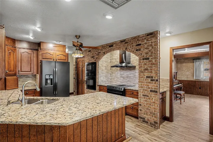 Kitchen features Breakfast bar seating and granite countertops