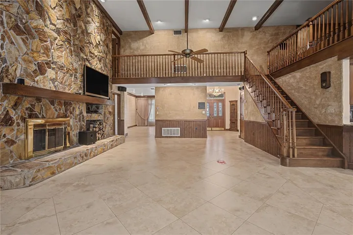 Expansive Family room with Wood burning fireplace open to second level