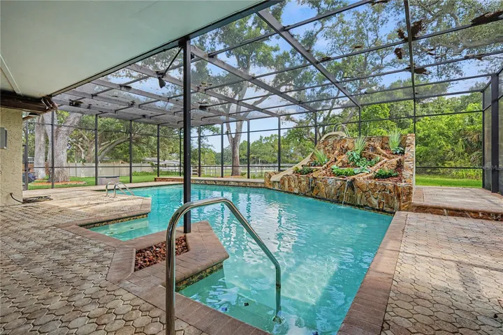 Sparkling Pool with slide, waterfall and screen.