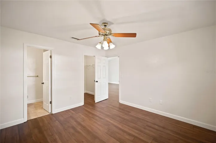 Primary bedroom with walk-in closet
