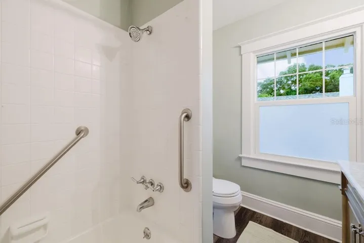 Full bathroom with shower and tub.