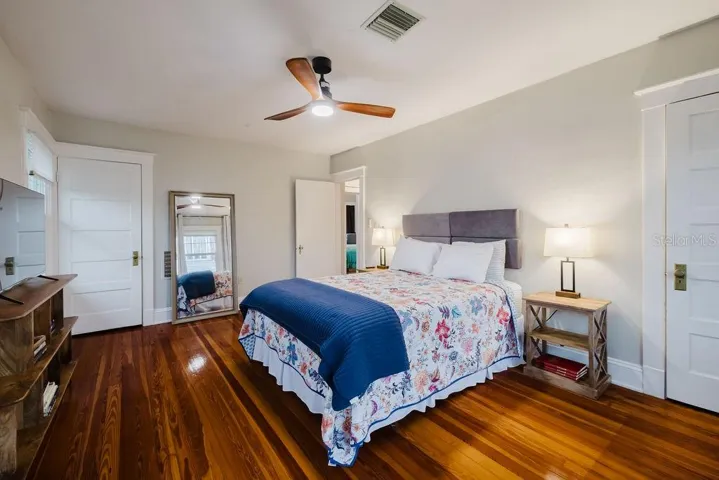Primary bedroom with double built-in closets.