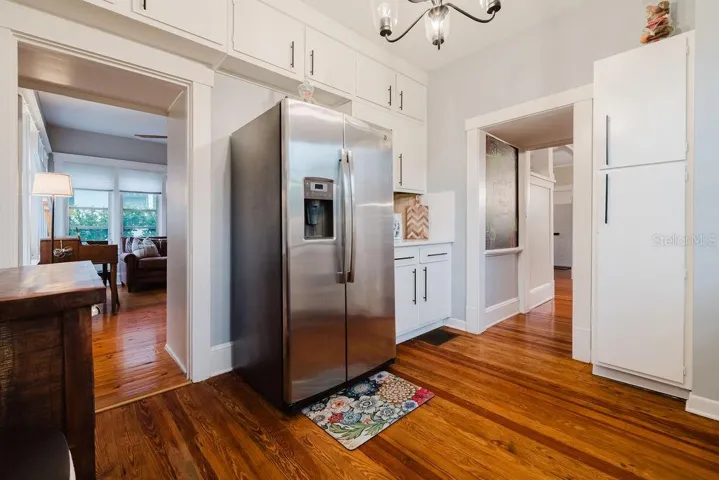Kitchen with dryer and storage room.