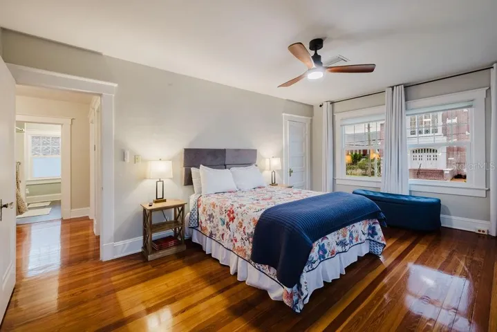 Primary bedroom with ceiling fan.