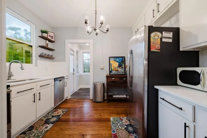 Updated kitchen with stainless steel appliances and all wood cabinets.