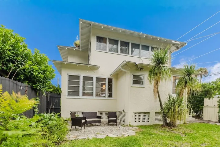 East side of home with private, fully fenced back yard and seating area.