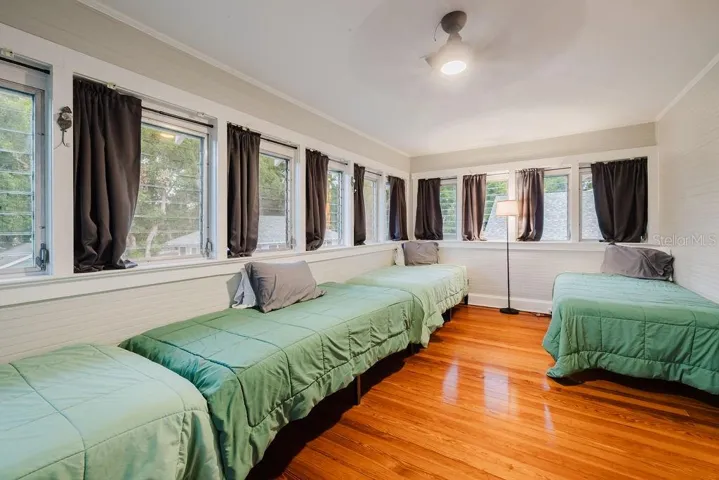 Bedroom 3 with lots of natural light and windows. Currently set for a short term rental.